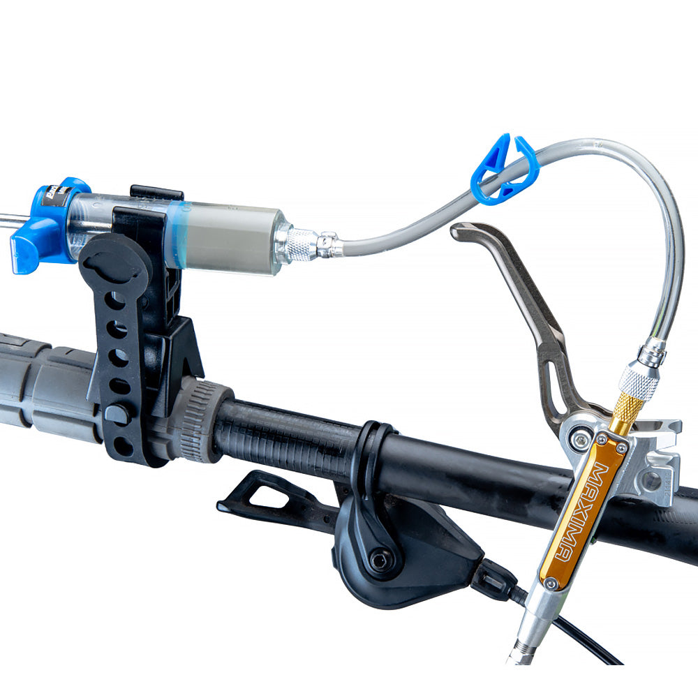 Park Tool Syringe Holder & Strap For Bleed Kits (2578A) in use during brake bleeding trickstuff maxima brake lever