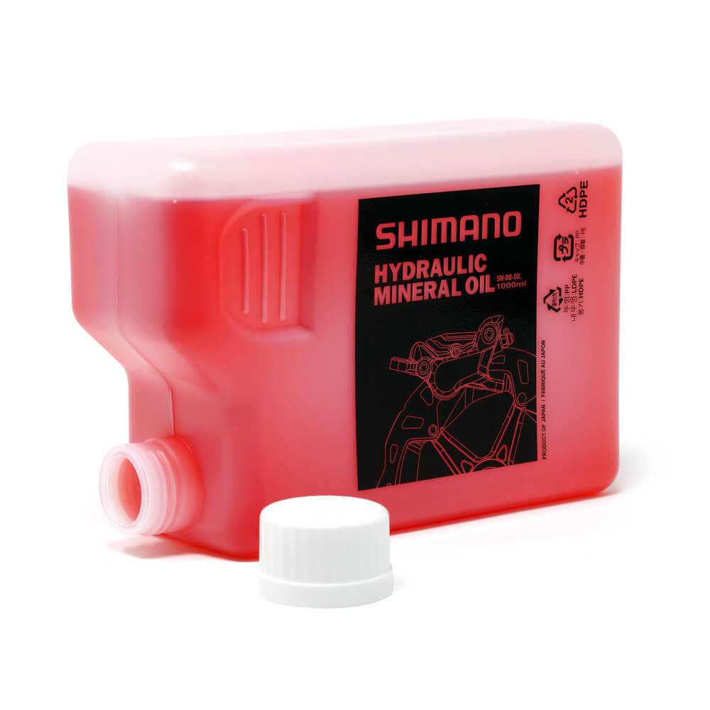 shimano mineral oil brake fluid sm-db-oil 1 litre 1L bottle lying on side leak proof opening