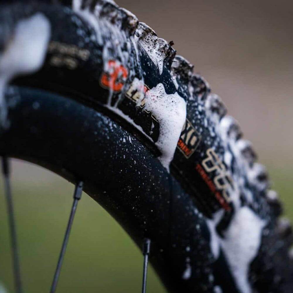 close uup of mtb tyre soapy during wash suds
